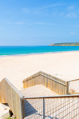 Steps to sandy Bolonia beach on southern coast of Spain near Tarifa town
