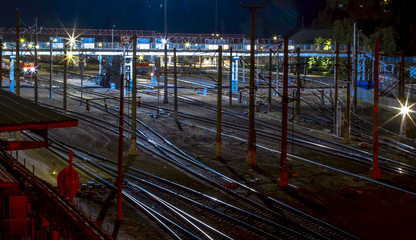 Fototapeta na wymiar Night train station and a train on the way.