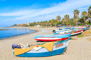 Fototapeta na wymiar Fishing boats on beautiful beach near Marbella, Andalusia, Spain