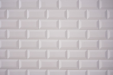 Ceramic rectangular white tile laid horizontally. Glazed white ceramic brick for interior walls