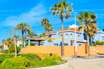 Fototapeta na wymiar Holiday apartments with palm trees near Estepona town on Costa del Sol, Spain