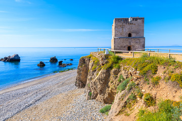 Fototapeta na wymiar Castle tower on beach near Estepona town on Costa del Sol, Spain
