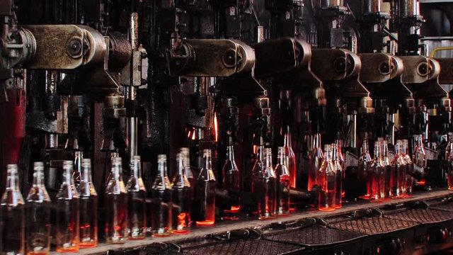 Production of glass bottles for juice or beer on the factory