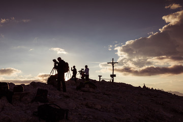 Photographers on the summit of Mount Lagazuoi awaiting the sunset, Dolomites, Italy