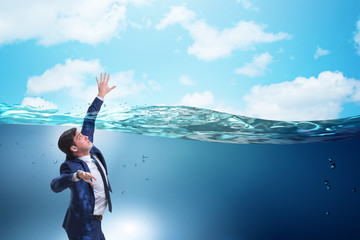 Drowning businessman in insolvency and bankruptcy concept