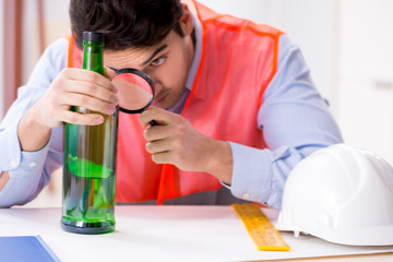 Drunk engineer working in the workshop