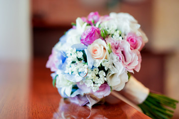 a bouquet of flowers of pink blue orange red and white on the grass
