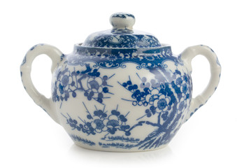 Traditional russian sugar bowl with blue floral painting in Gzhel style isolated on white.