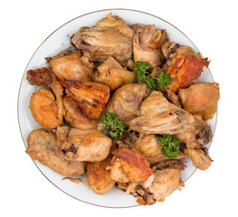 Dish with slices of fried chicken isolated on a white background.