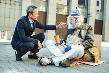 Feel sorry. Helpful public officer involved in charity work feeling very sorry for poor starving...