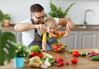 Printed kitchen splashbacks Cooking happy family father with son preparing vegetable salad