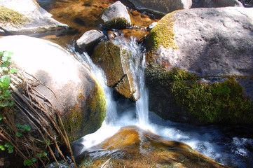 Sunset on a small stream and rocks in the Sangre De Cristo Mnts of Southern Colorado.