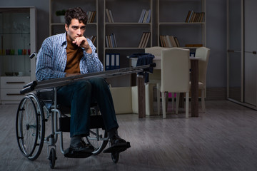 Obraz na płótnie Canvas Man suffering from depression at wheelchair