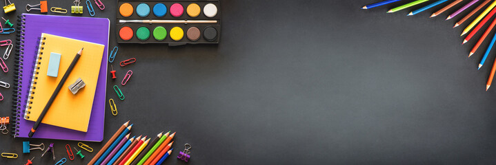 Back to School Concept with Stationery Supplies and Blackboard