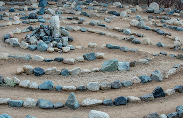 Traditional natural stone walking labyrinth maze made for contemplation and worship, created with...