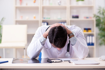 Young doctor sitting in the office