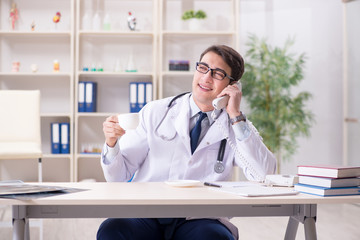 Young doctor sitting in the office