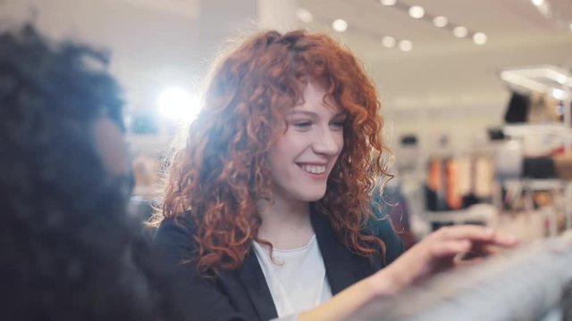 Close up happy beautiful women discussing clothes in the store african american woman smile fashion girl fitness technology beautiful happy female well-dressed consumerism shopper lifestyle young