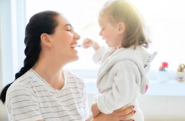 family are brushing teeth