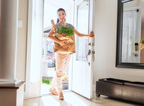 Woman Holding Grocery Shopping Bag