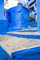 amazing stairs in between blue adobe buildings | chefchaouen, morocco