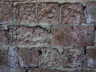 fragment of an old brick wall