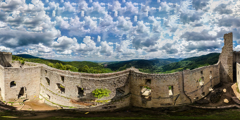360-degree panoramic aerial view from drone to Vosges mountains and ruins of medieval castle...
