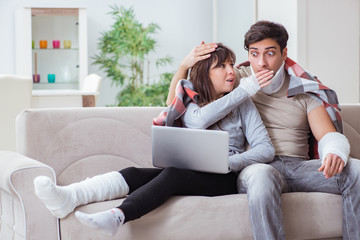 Fototapeta premium Injured family of wife and husband recovering at home
