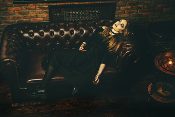 gothic woman on sofa