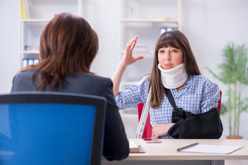 Injured employee visiting lawyer for advice on insurance