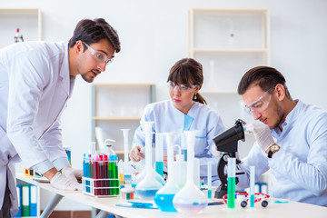 Team of chemists working in the lab