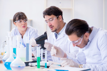 Team of chemists working in the lab
