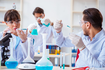 Team of chemists working in the lab