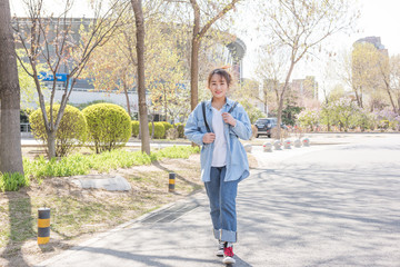 Female student walking in campus  