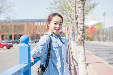 College Girl With Backpack on Campus. Asian chinese college female student 