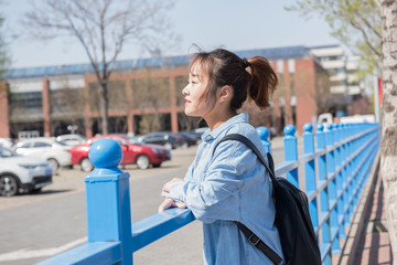 Obraz premium College Girl With Backpack on Campus. Asian chinese college female student 