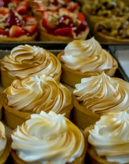 Meringe, a tasty Brazilian dessert, viwed through the window of a bakery