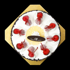 top view ice cream cake with strawberry, cherry, pineapple, chocolate and happy birthday chocolate plate for sweet dessert from bakery shop on black background, isolated included clipping path