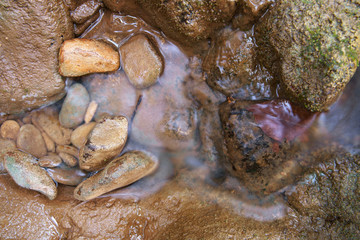 stream and waterfall with rock or stone in green jungle or forest for summer holiday relax on nature and adventure travel trip at Khao Laem National Park