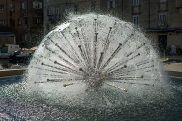 Fountain in Cres, shape of a sphere in direct sunlight