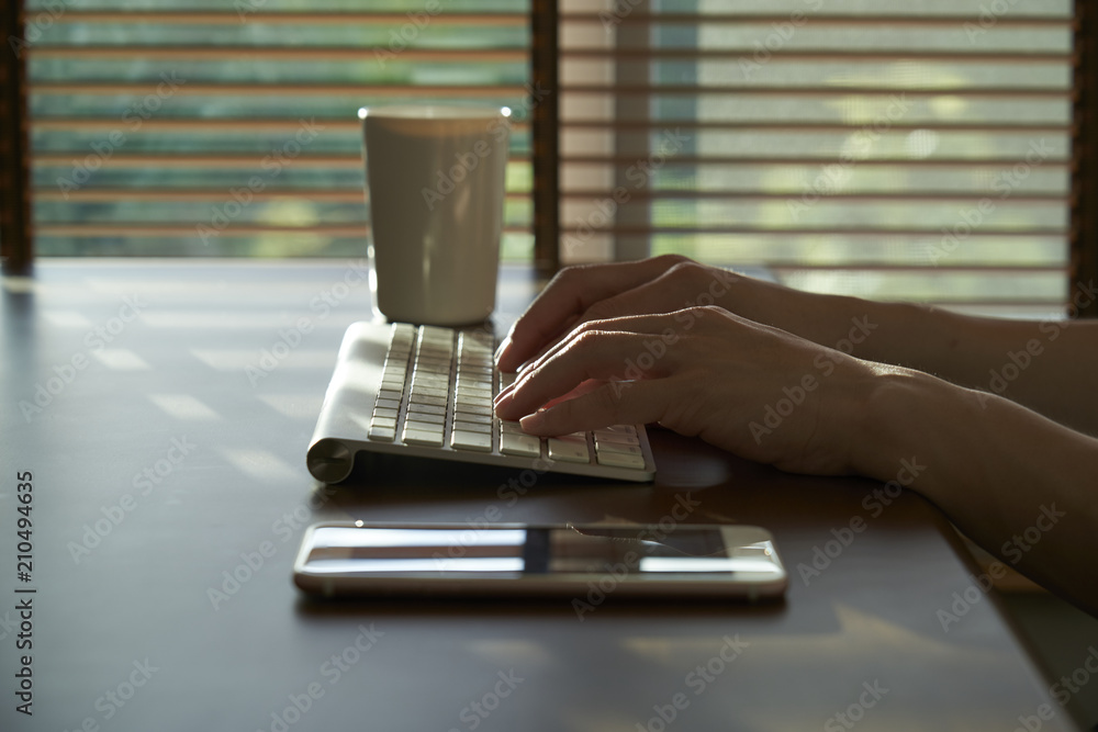 Poster hand typing keyboard. searching browsing internet data information. warm tone.