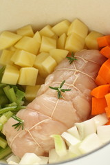 Prepared chicken stuff roll and cut vegetables