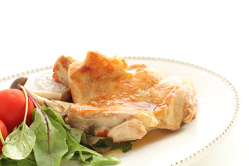 Chicken sauteed served with tomato and baby leaf