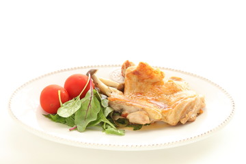 Chicken sauteed served with tomato and baby leaf