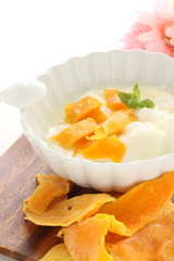 Fototapeta na wymiar dried mango and mint on yogurt