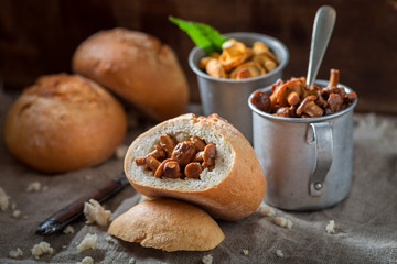 Closeup of bun with mushrooms made of fresh chanterelles