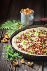 Closeup of tarts made of wild mushrooms on wooden table