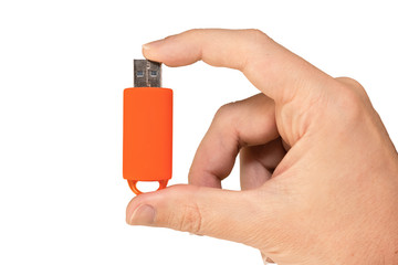 Orange USB Flash drive on hand with isolated white background