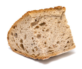 slice of rye porous bread close-up on white background