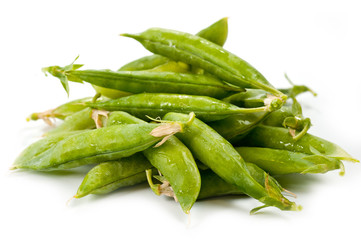 Green peas bright juicy and delicious shot close-up on a white background